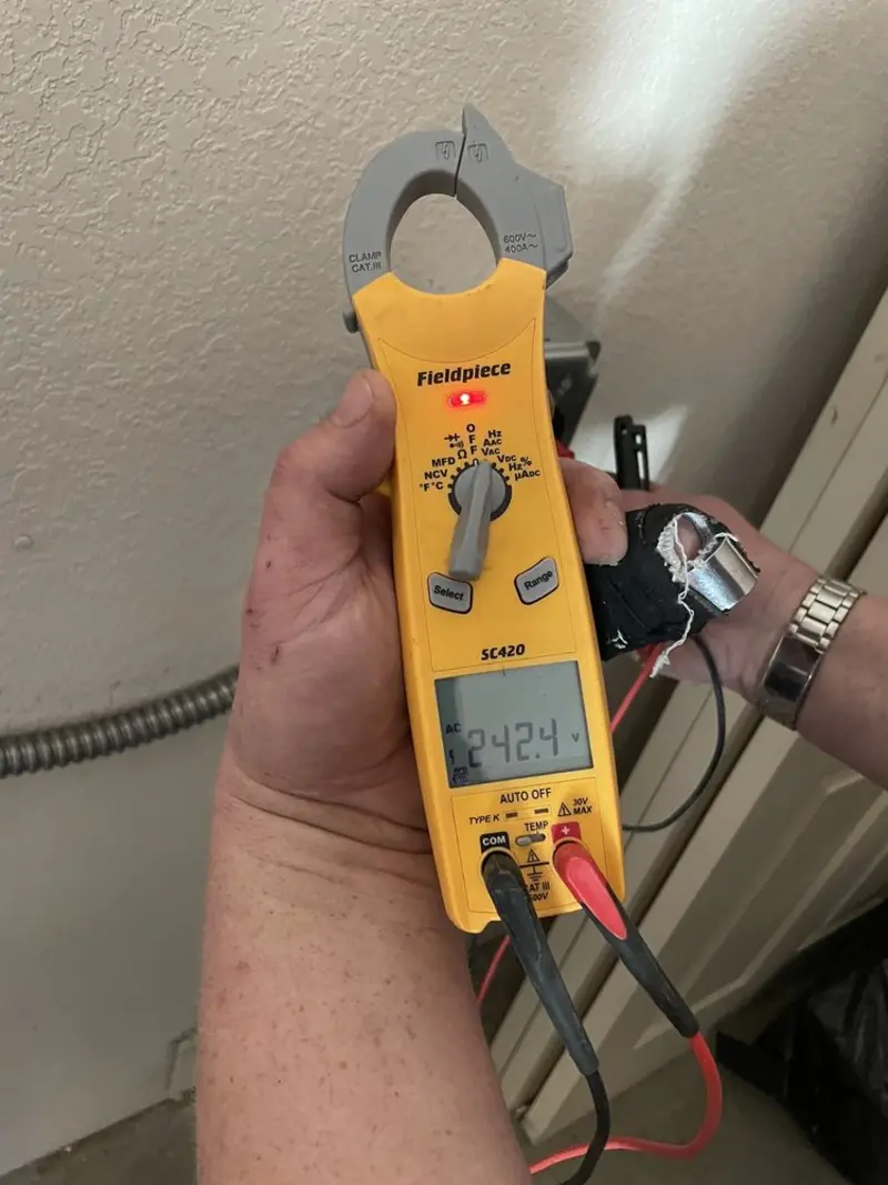 Voltage testing with clamp meter during Electrical Installation Services in Monterey